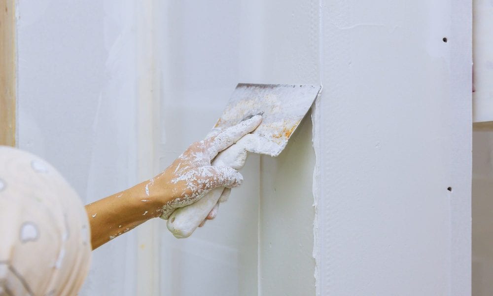 male builder repairs